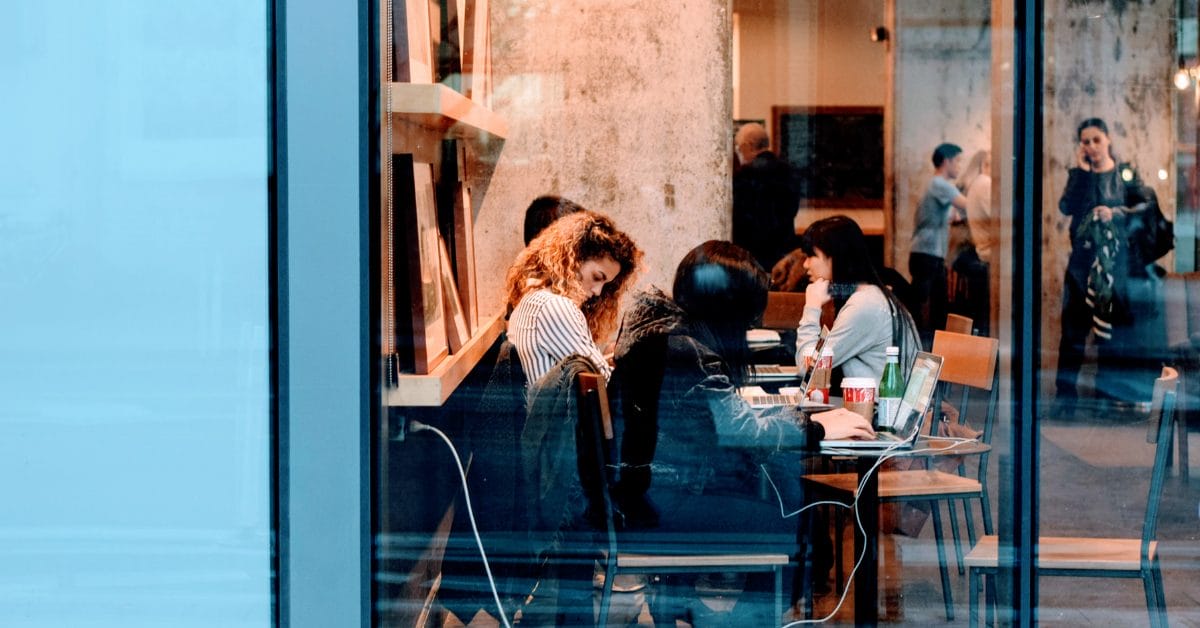 remote workers working in a coffee shop