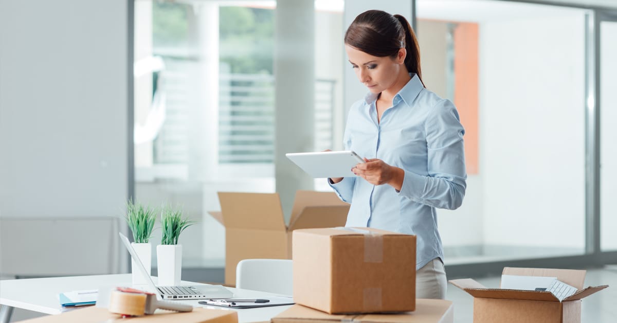 Woman packing her office for a business relocation