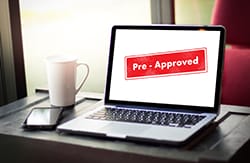 Laptop computer with pre-approved notice on screen