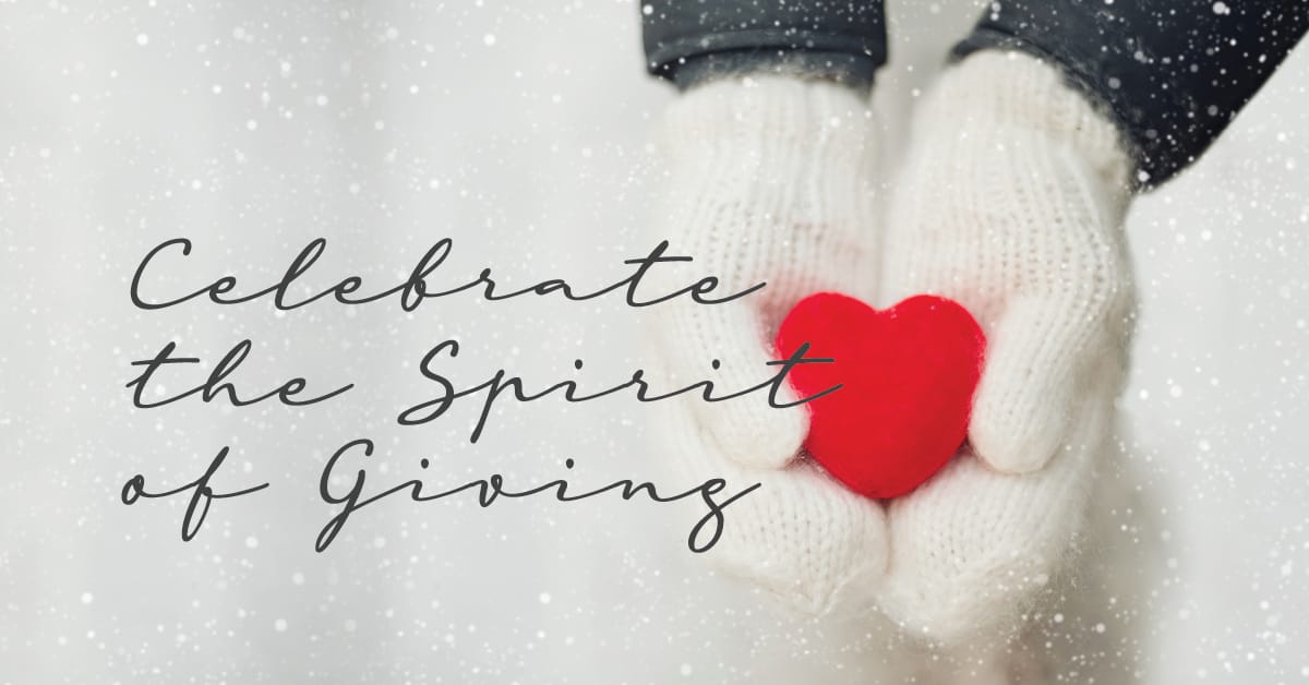 Celebrate the Spirit of Giving with mittened hands holding a red heart