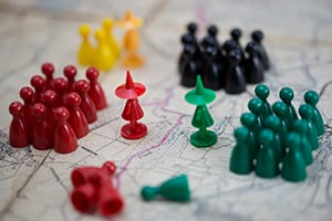 multiple parties in a standoff on a map signifying political unrest