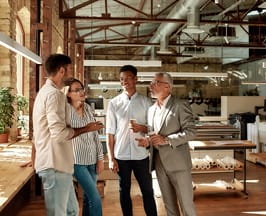 group of employees chatting it up during a coffee break
