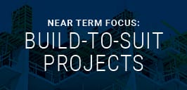 Near term focus build-to-suit projects text on construction site