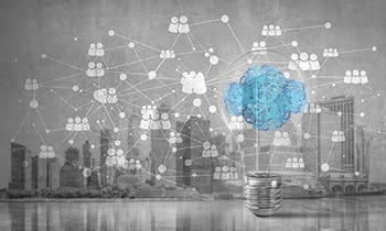 collaborative ecosystem concept of lightbulb with cloud from gears inside placed against social network system on grey wall overlay on San Diego skyline