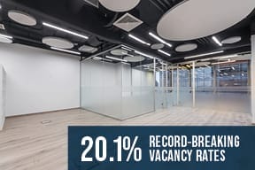 record-breaking vacancy rate of 20.1% overlay on empty office space