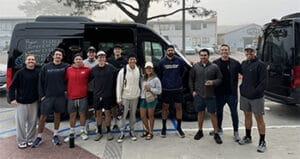 Voit team members in front of their two vans