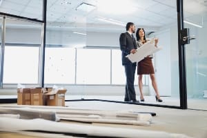 managers reviewing renovation plans to upgrade office areas