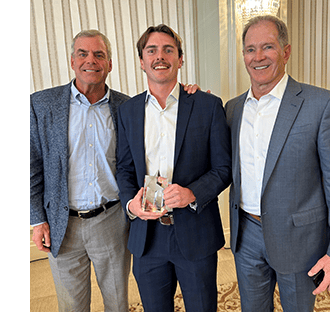 Reed Rutter 2025 Rising Star with CEO Eric Hinkelman and Chairman of the Board and Top Producer Mike Hefner
